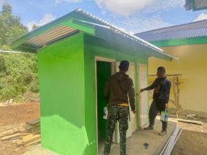 Personil Satgas TMMD Cat MCK Madrasah Nurul Falah